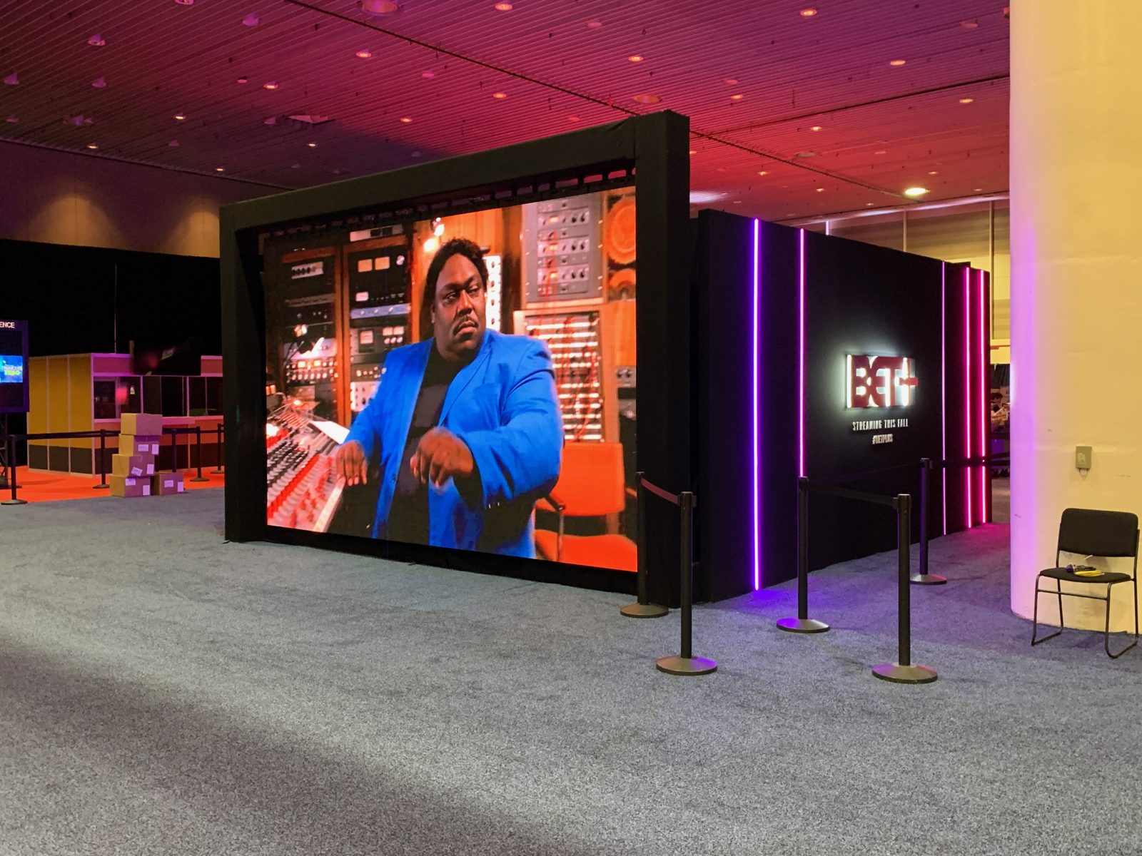 Large LED video wall displaying live content at an event activation